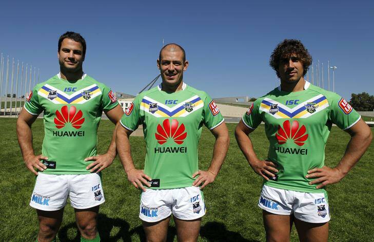 Raiders captain Terry Campese, centre, with David Shillington, left, and Tom Learoyd-Lahrs, right, model the Raiders' new jerseys following yesterday's sponsorship announcement with Huawei. Photo: Katherine Griffiths