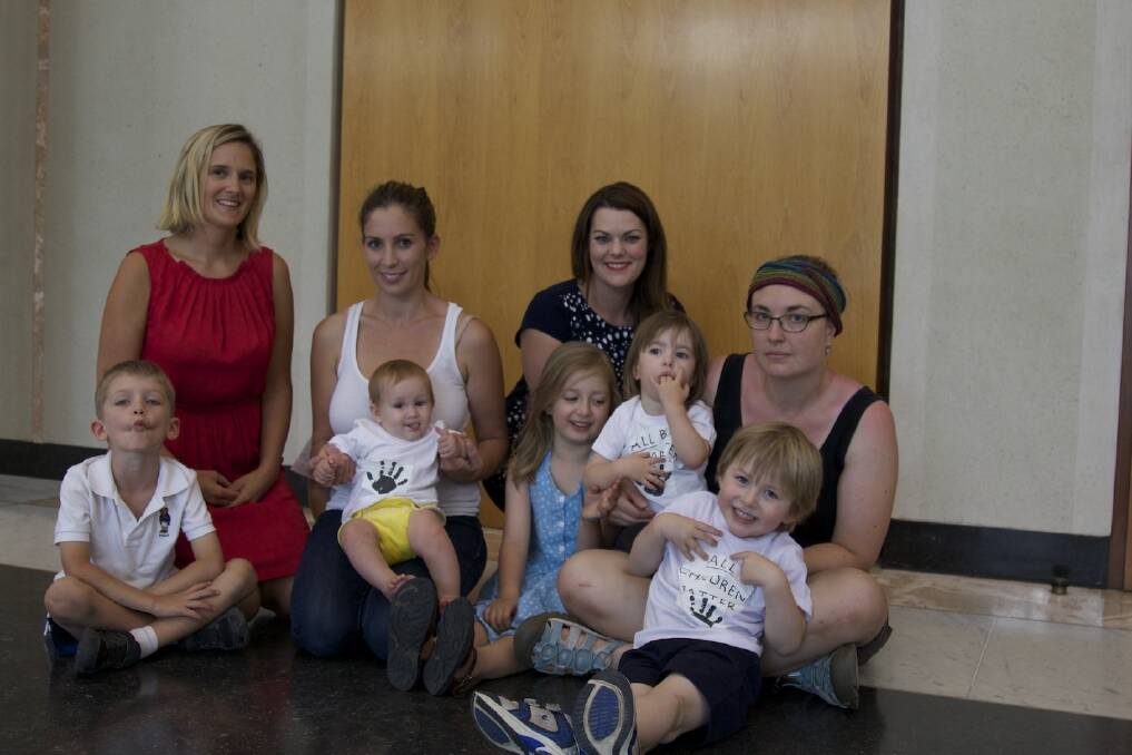 Greens Senate candidates Christina Hobbs and Carly Saeedi with Senator Sarah Hanson-Young, Aileen Tong and children Zak, Anya, Rose, Sylie, and Leo involved in the sit-in at Parliament House protesting the treatment of asylum seeker baby Asha. Photo: Supplied