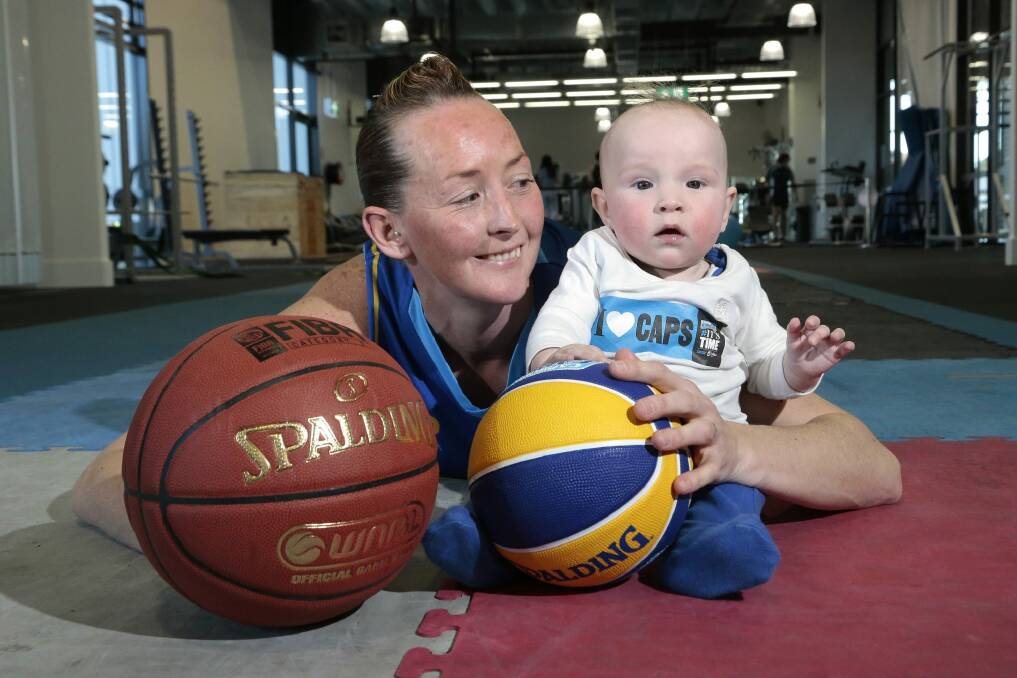 Canberra Capitals guard Michelle Cosier returned to the court for the first time in 18 months since having youngest son Levi. Photo: Jeffrey Chan