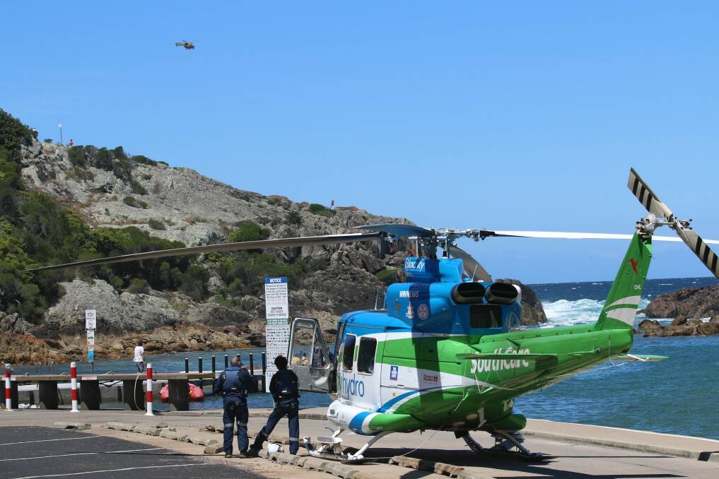 Emergency crews were called to Tathra after a group of Canberra fishermen were swept off the rocks. Photo: Jacob McMaster