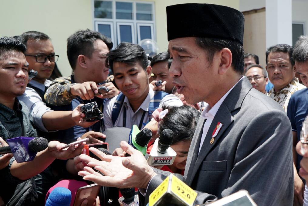 Joko "Jokowi" Widodo speaks to journalists at an Islamic microfinance bank in Balaraja, Banten province. Photo: Jefri Tarigan
