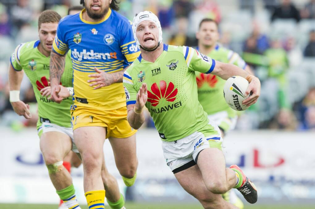 Raiders captain Jarrod Croker on the attack with TTM Security appearing on his jersey above major sponsor Huawei. Photo: Jay Cronan