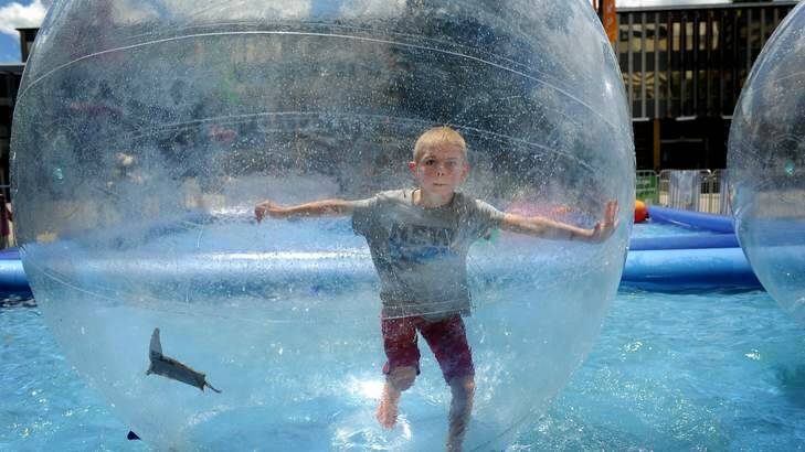 Noah Cross, 6, plays in the floating bubble that has been set up in Civic Square. Photo: Colleen Petch