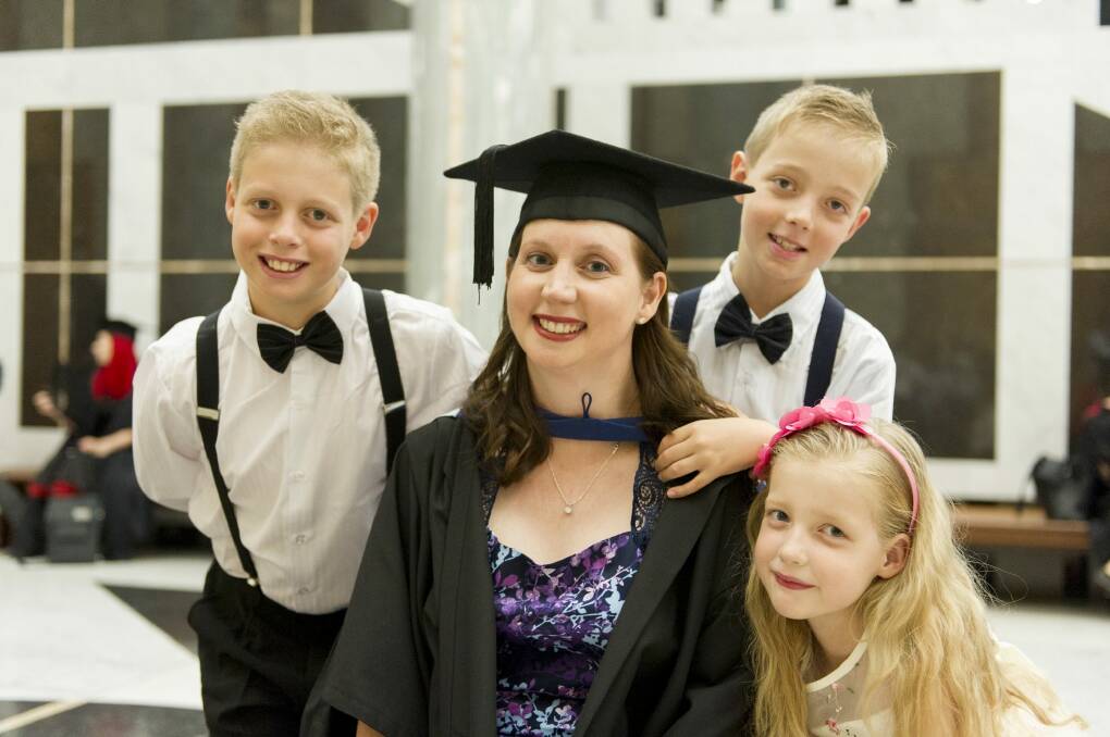 Tanya Stiller, with her three children Lachlan, 10, Riley, 8,  and Lily, 6 at Tanya's gradation ceremony at Parliament House. Photo: Jay Cronan