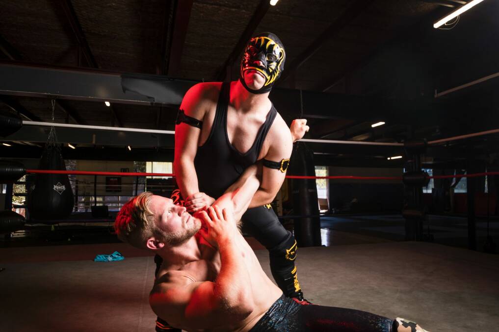 Luke Bernie (in the mask) met Kane Broadrick in 2007 and the pair studied in Canada under former WWE wrestler Lance Storm. Photo: Dion Georgopoulos