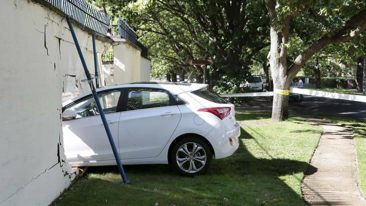 The car lodged in the wall of the Lodge in Canberra after a collision on Saturday morning. Photo: Jeffrey Chan
