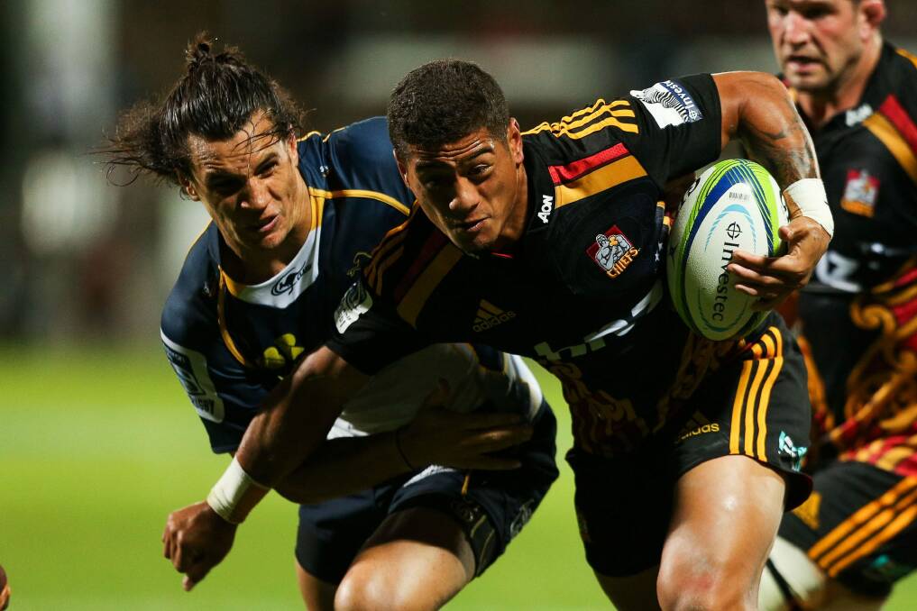 Augustine Pulu of the Chiefs is tackled by Matt Toomua of the Brumbies on Friday. Photo: Getty Images