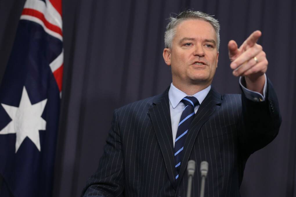 Mathias Cormann has accused Labor of trashing economic legacy by embracing socialism which, he says, will crush aspiration and drive successful people from Australia. Photo: Andrew Meares