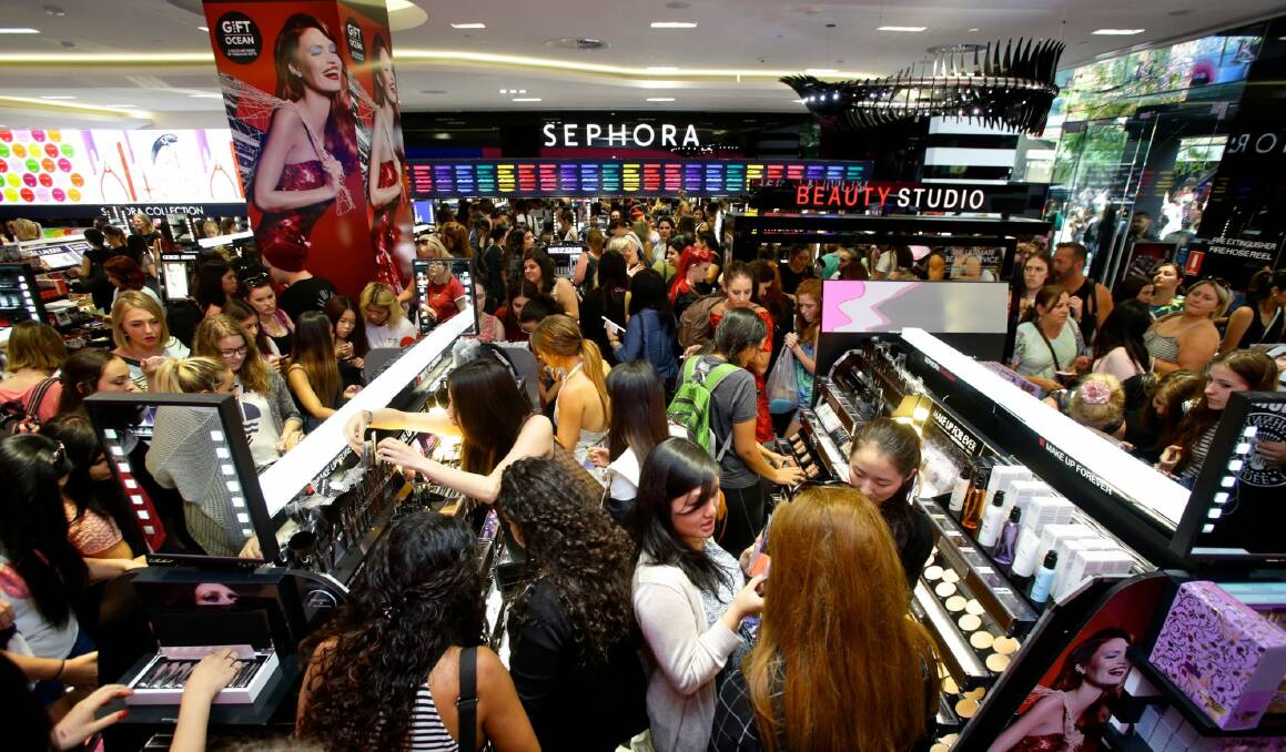Crowds rushing through the doors of Australia's first Sephora store, which opened in Sydney on Friday. Photo: Dallas Kilponen