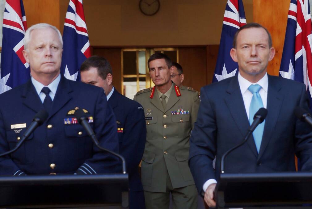Lieutenant General Angus Campbell (centre) was announced as the new Chief of Army by Prime Minister Tony Abbott on Thursday. Photo: Andrew Meares