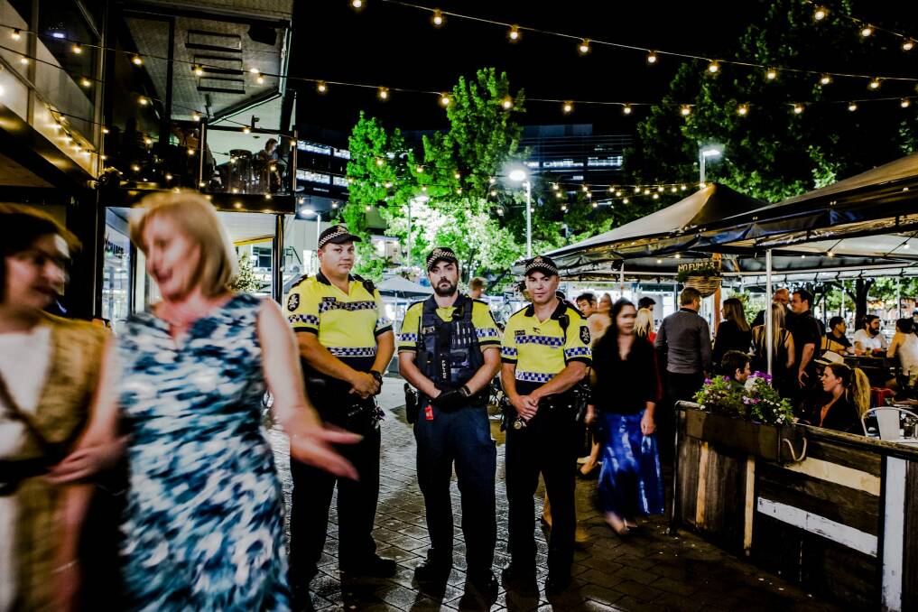 Revellers can expect bolstered police and paramedic crews in Civic for New Year's Eve celebrations. ACT Policing's regional targeting team members Acting Sergeant David Power, Constable Julian Carey, and Constable James Sutherland. Photo: Jamila Toderas