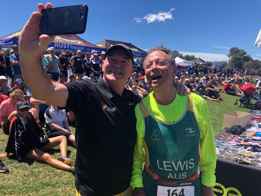 Australian marathon legend Rob de Castella takes a selfie with 81-year-old triathlete Lachlan Lewis.  Photo: Jeremy Lasek