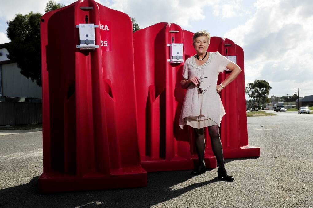 CEO of Canberra CBD limited Jane Easthope with the portable urinals. Photo: Jay Cronan