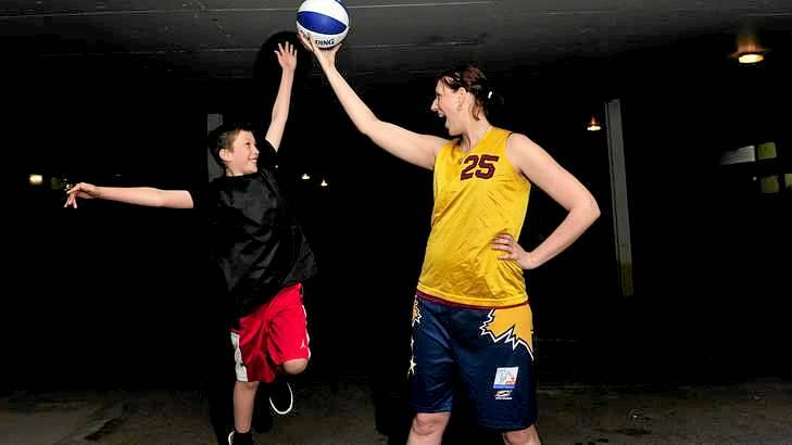 Former Canberra Capitals basketballer Tracey Beatty has some fun with her nine-year-old son Bowyn this week. Photo: Melissa Adams