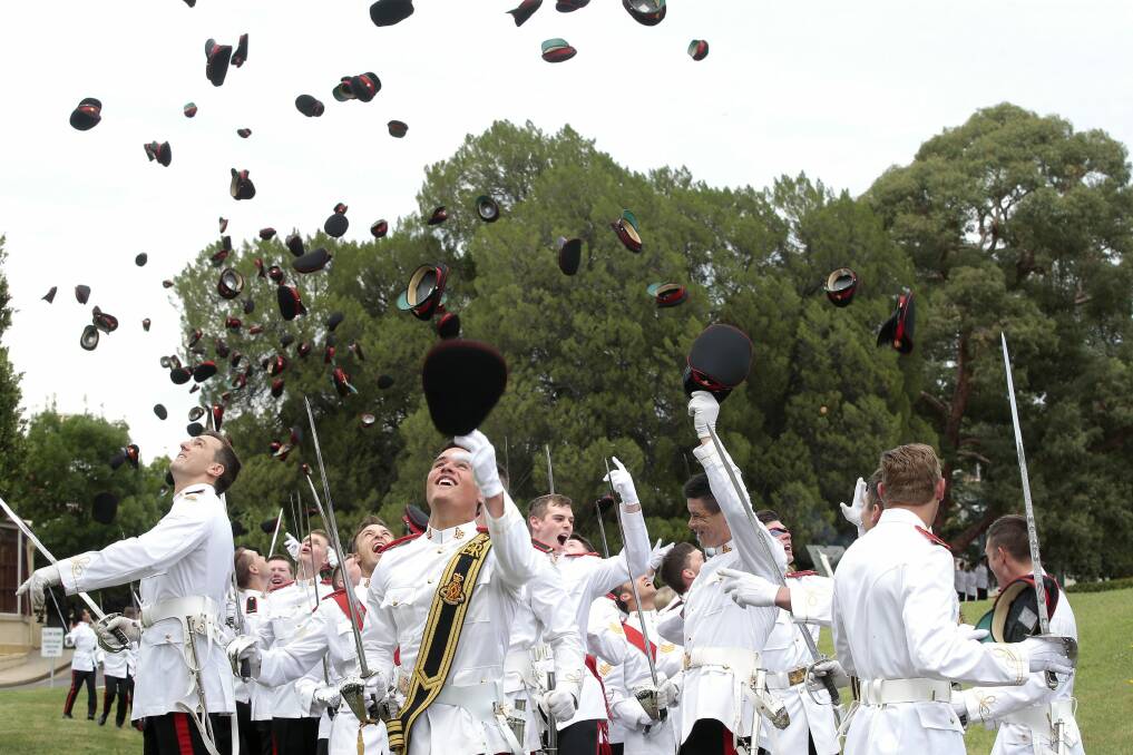 Graduates of the 2015 class at the Royal Military College, Duntroon, celebrate their success. Photo: Jeffrey Chan