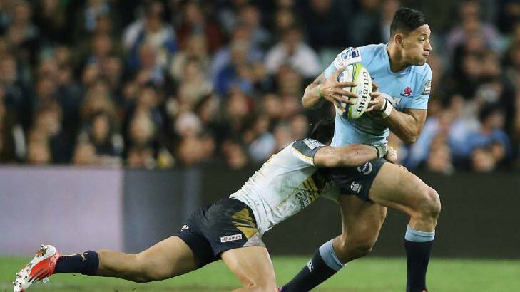 On the loose: Waratahs fullback Israel Folau tries to make a break against the Brumbies. Photo: Getty Images