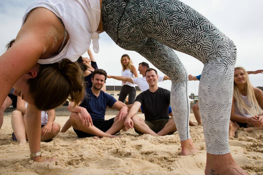 Lululemon's Kyle Housman and Ben Jackson on Bondi Beach, where the label will launch its first concept store outside of North America. Photo: Edwina Pickles