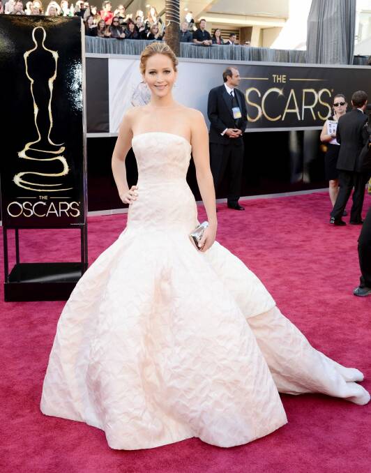 Jennifer Lawrence in clotted cream Dior at the 2013 Oscars...before she fell up the stairs. Photo: Jason Merritt