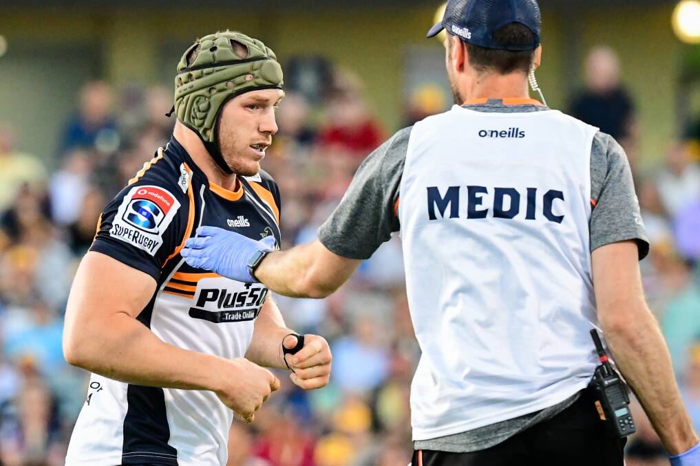David Pocock had to be helped from the field and didn't return on Friday night. Photo: Stuart Walmsley/rugby.com.au