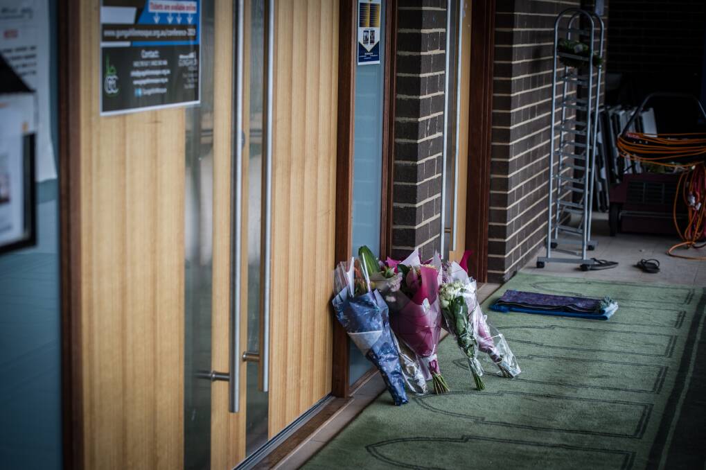 Bunches of flowers left in sympathy after the New Zealand shootings at the door of the Gungahlin mosque. Photo: Karleen Minney 