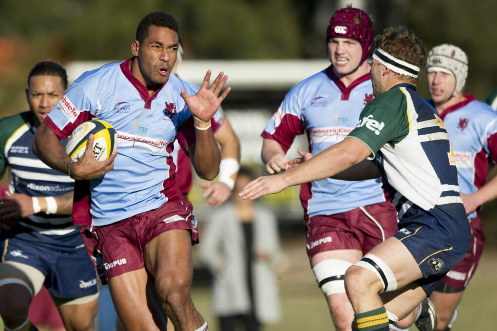 Wests' Ratu Tagive fends off a Uni-Norths player. Photo: Jay Cronan