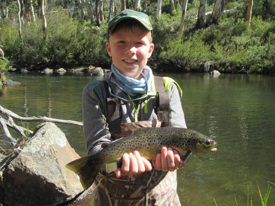 Eleven-year-old Michael Vincent with a trout caught near Yaouk. Photo: DAVID VINCENT