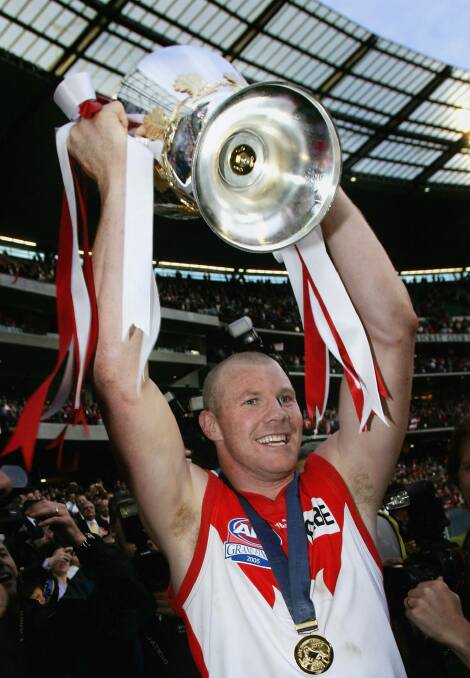 Barry Hall lifts the premiership cup after the Swans' 2005 grand final win over the Eagles. Photo: Getty Images