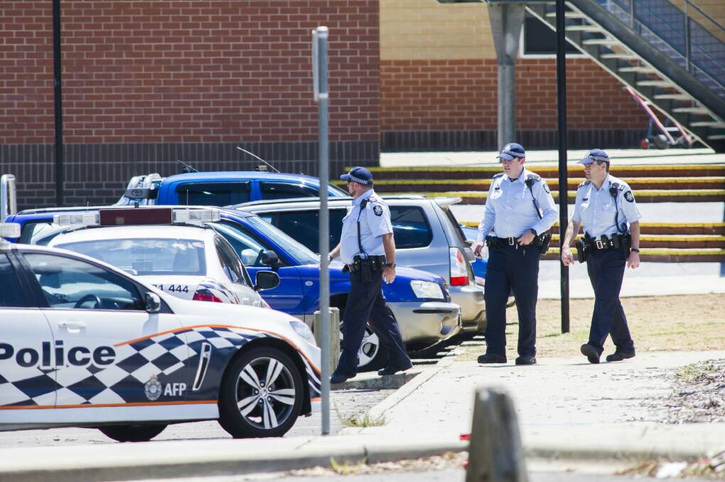 ACT Policing officers outside Lanyon High School on Tuesday following a bomb threat. Photo: Rohan Thomson