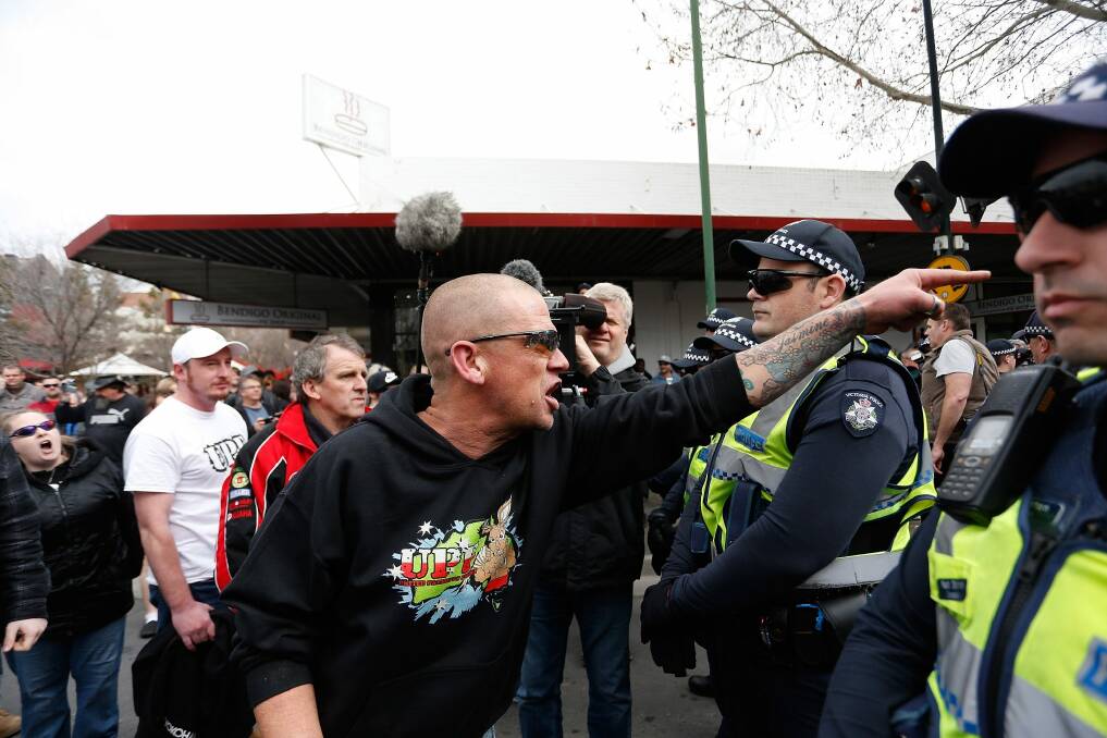 An anti-mosque protester yells over police lines at a rally in August.  Photo: Meredith O'Shea