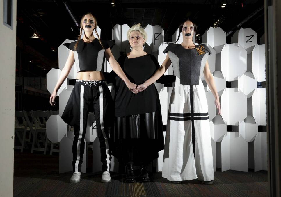 Canberra clothing designer, Louisa de Smet
of Watson with two of her creations under the label of "Corr Blimey",
modelled by Queanbeyan models, Cecilia North, left and Chelsea Marolt.
 Photo: Graham Tidy