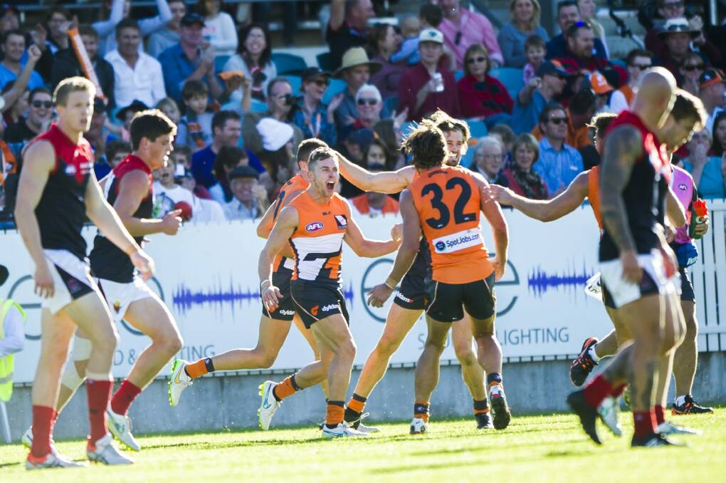 GWS Giants players celebrate a goal during their win against Melbourne earlier this year at Manuka Oval. Photo: Rohan Thomson