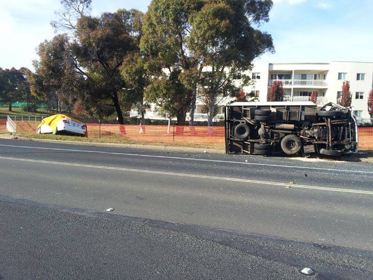 It is believed the car was turning right out of Florey Drive when it collided with the eastbound truck on Southern Cross Drive.