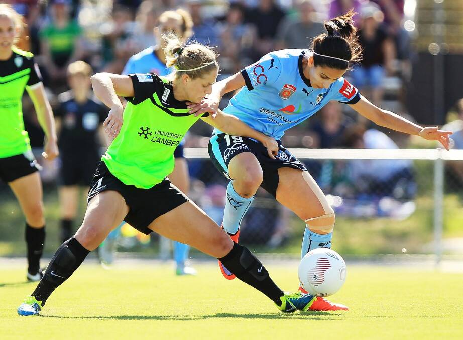 Canberra United defender Ellie Brush (left) challenges Sydney FC's Leena Khamis for the ball in last week's W-League game in Sydney. Photo: Getty Images