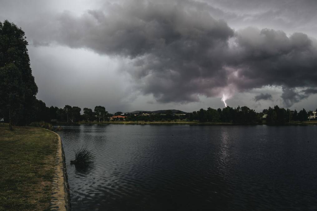 Fisherman braved heavy rain and lightning over Gungahlin in the chase for a big catch. Photo: Rohan Thomson