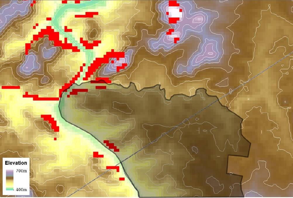 Map of elevation around the Ginninderry region, with the land subject to rezoning in dark shading. The red pixels indicate locations with slopes above 20°, that are prone to extreme fire behaviour. Photo: UNSW Canberra