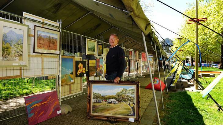 Art show organiser Barry Cranston inside the City Walk tent which was provided by Defence. Photo: Colleen Petch