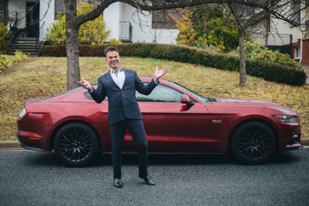 Steve Thomas after being reunited with his red mustang after having it hijacked in Yarralumla on Thursday morning. Photo: Rohan Thomson