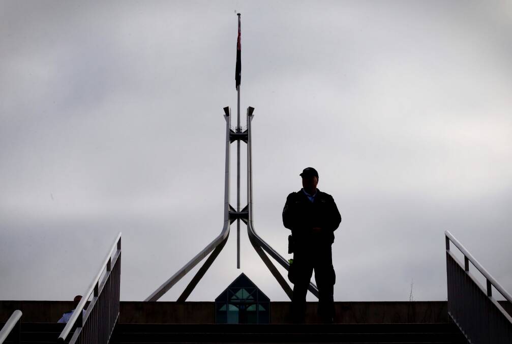 Protective services officers are  charged with guarding Commonwealth properties, such as Parliament House, among other duties. Photo: Andrew Meares