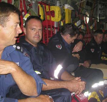 Craig Perks, looking at Camera, aboard the Hercules on route to Christchurch. Photo: Supplied