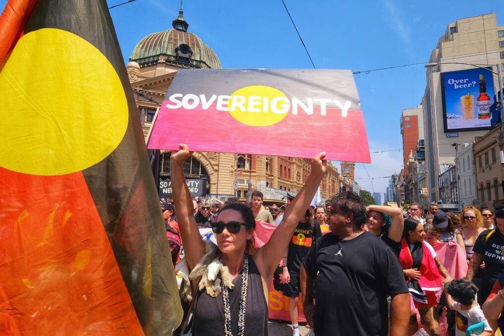 Aboriginal and pro-Aboriginal protestors march through Melbourne on January 26. Photo: Luis Ascui