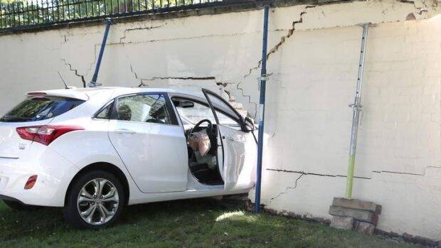 Car crashed into the wall of the Lodge in Canberra after a crash in July, 2014. Photo: Jeffrey Chan