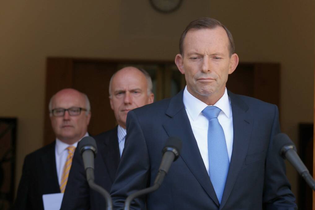 Seeking an election trigger? Prime Minister Tony Abbott with senators Eric Abetz and George Brandis.  Photo: Andrew Meares