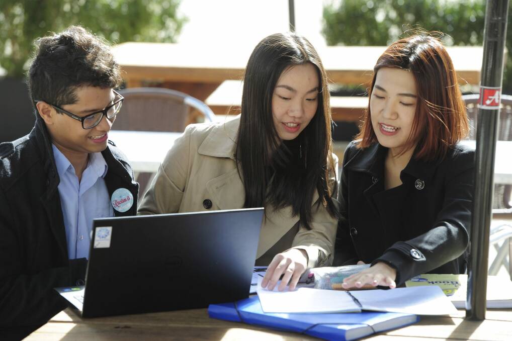 International ANU students Antonio Alvarez, Arabelle Zhang and Kathy Song. Photo: Graham Tidy.