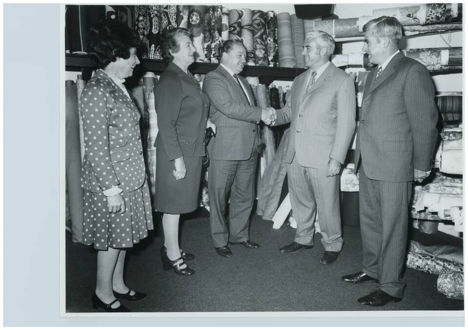 Joan Waldren, Mary Cusack, Jim Pead, John Cusack and  David Cusack in the Cusacks Furniture Store in Kingston after the store was rebuilt following a fire in 1976. Photo: Supplied