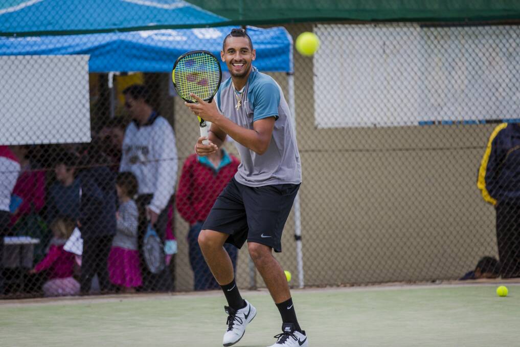 Australian tennis star Nick Kyrgios preparing to hit a shot at the Weston Creek Tennis Club's Tennis Carnivale on Saturday. Photo: Jamila Toderas
