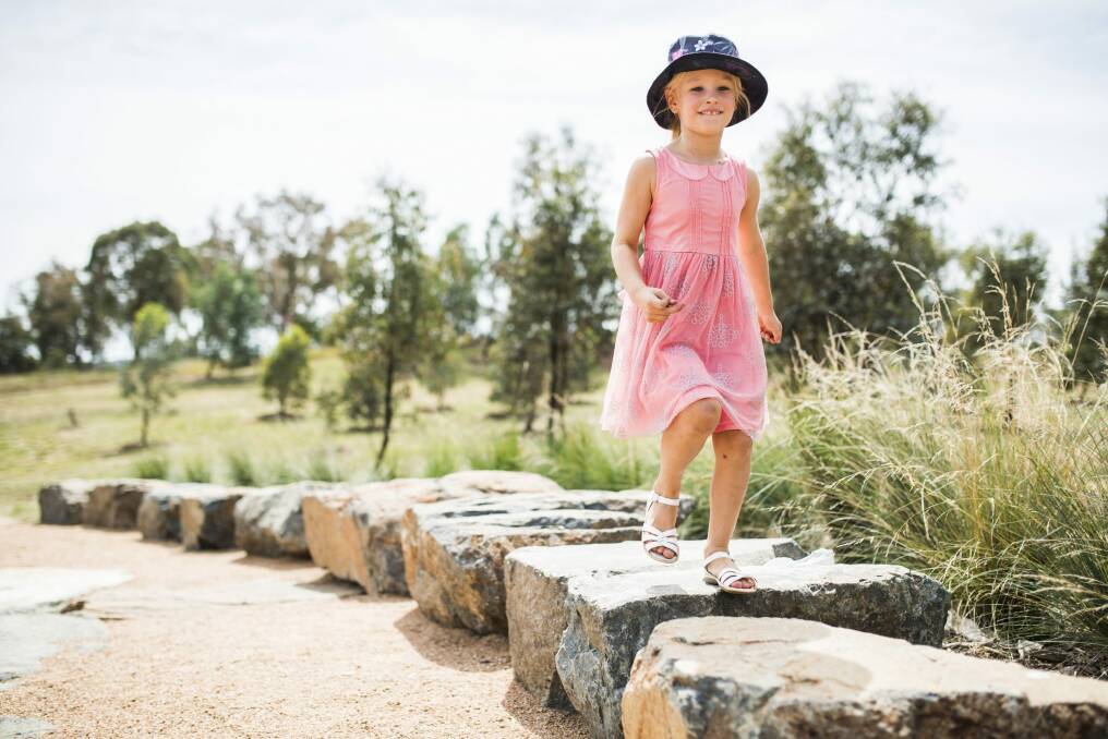 Elizabeth Latimore, 5, from Giralang, in the new Forrest20 space. The Clearing is a small rock amphitheatre built by STEP volunteers to help educate visitors and students about the adjacent Forest 20 which has a demonstration garden displaying over 100 local region species.

Photo: Rohan Thomson
The Canberra Times Photo: Rohan Thomson