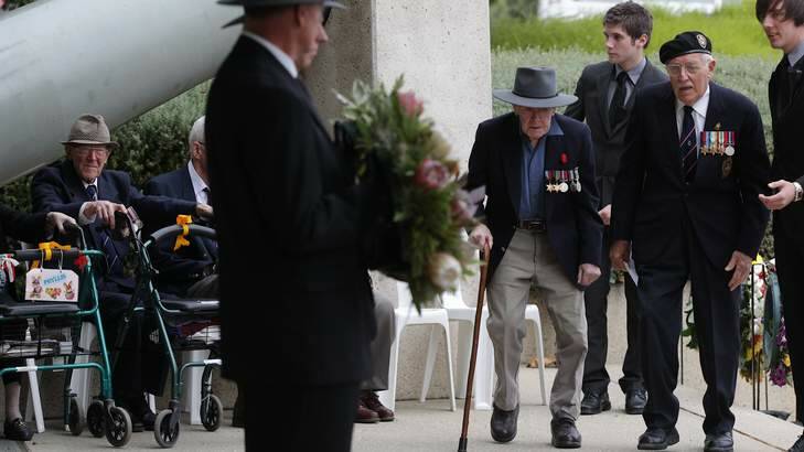 PAYING RESPECTS: Ricco Eccles, with walking stick, prepares to lay a wreath on Wednesday. Photo: Alex Ellinghausen
