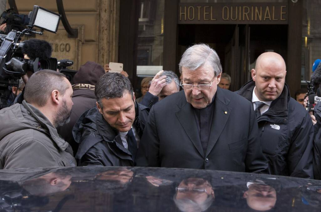 Cardinal George Pell leaves the Quirinale Hotel after meeting victims of sex abuse in March.  Photo: Riccardo De Luca