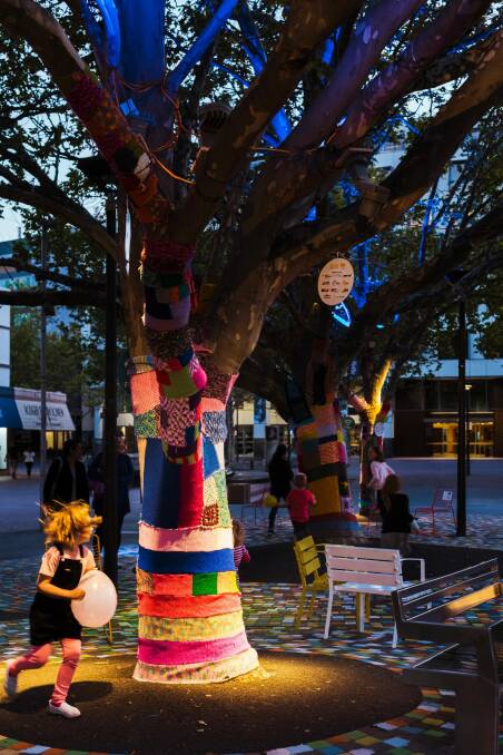 Part of the installation saw the bases of trees be covered by knitting. Photo: Supplied