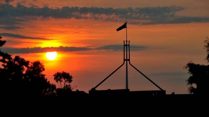 The sun sets over Parliament House. Photo: Karleen Minney